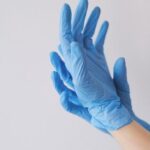 closeup-shot-person-s-hands-wearing-blue-gloves-750x437